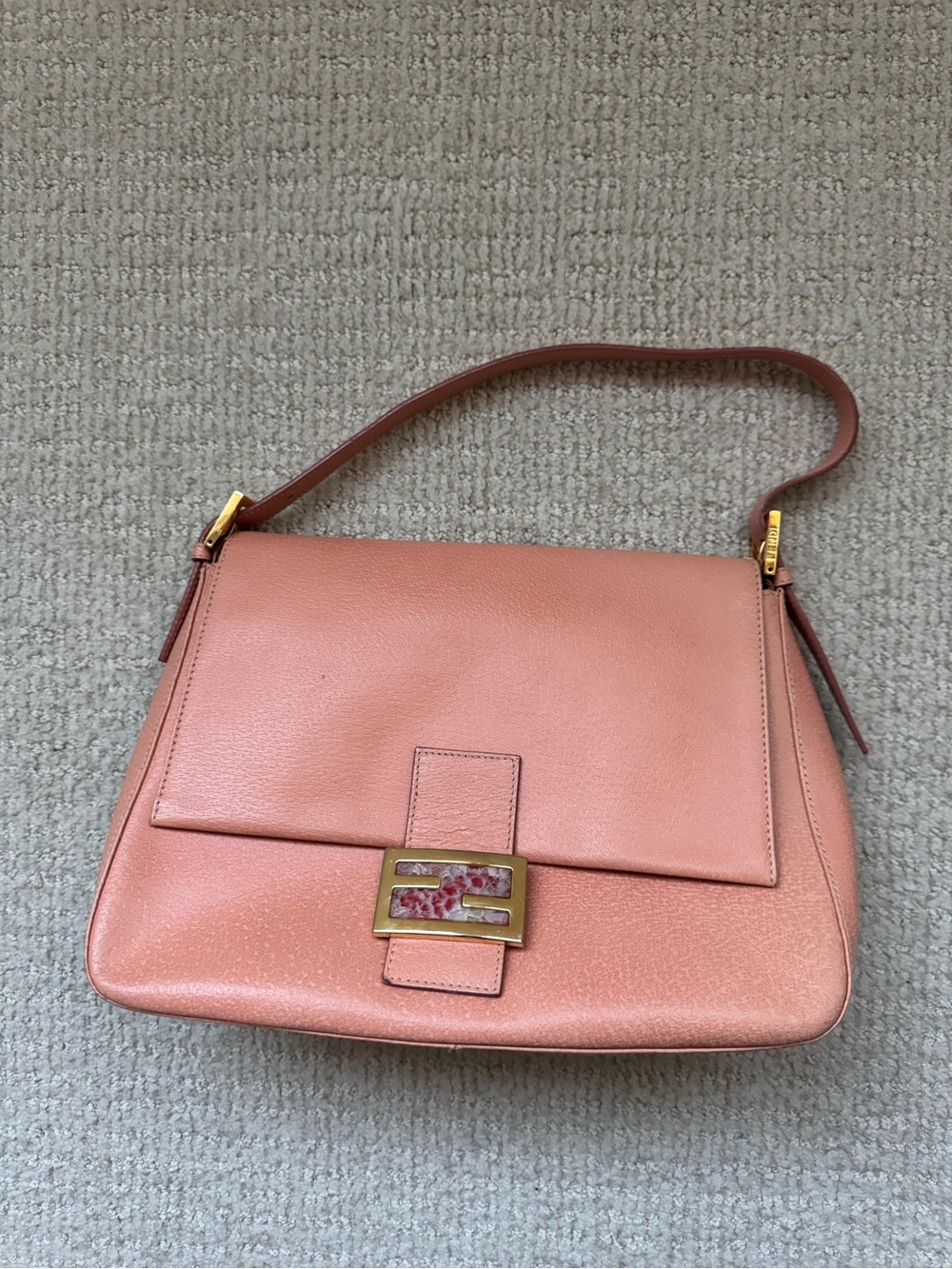 Salmon pink Fendi Mama Baguette bag with marble clasp detail. Great condition.